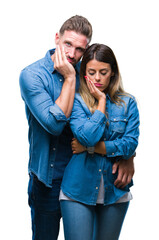 Young couple in love over isolated background thinking looking tired and bored with depression problems with crossed arms.