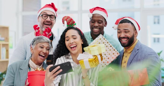 Creative group, Christmas and selfie for party celebration, festive season or December holiday at office. Happy people or employees smile at work event for gifts, surprise or photo in memory and vlog