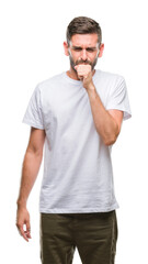 Obraz premium Young handsome man over isolated background feeling unwell and coughing as symptom for cold or bronchitis. Healthcare concept.