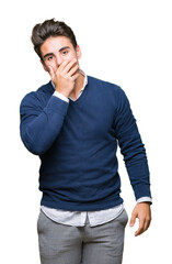 Young handsome business man over isolated background shocked covering mouth with hands for mistake. Secret concept.