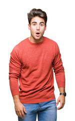 Fototapeta premium Young handsome man over isolated background afraid and shocked with surprise expression, fear and excited face.