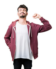 Young handsome man over isolated background stretching back, tired and relaxed, sleepy and yawning for early morning