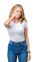Fototapeta premium Beautiful young woman wearing casual white t-shirt over isolated background Suffering of neck ache injury, touching neck with hand, muscular pain