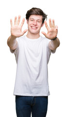 Young handsome man wearing casual white t-shirt over isolated background showing and pointing up with fingers number nine while smiling confident and happy.