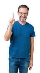 Handsome middle age hoary senior man wearin glasses over isolated background showing and pointing up with finger number one while smiling confident and happy.