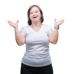 Young adult woman with down syndrome over isolated background crazy and mad shouting and yelling with aggressive expression and arms raised. Frustration concept.