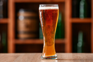 Glass of beer on table in bar. Oktoberfest celebration