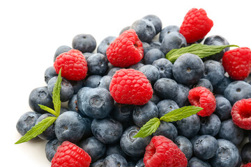 Ripe raspberry and blueberry on white background, closeup
