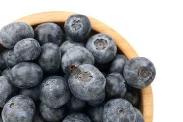 Bowl with ripe fresh blueberry on white background, closeup