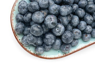 Plate with ripe blueberry on white background, closeup