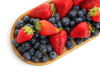 Wooden plate with ripe strawberry and blueberry on white background, closeup
