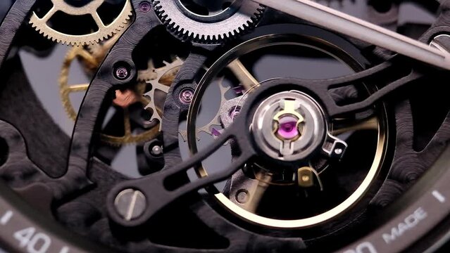 Gear drive motion in skeleton watch. Mechanical watches with gears and cogs. Watch or clock mechanism. Clockwork details and parts. Inside watch, mechanical watch in macro view.Macro Shot Clock Face