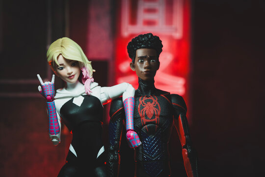 NEW YORK USA, AUG 1 2023: Marvel comics Spider-verse Miles Morales and Gwen Stacy sitting on an urban rooftop - Hasbro action figures