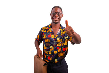 African businessman with briefcase smiles and gives thumbs up