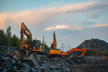 Excavators working on earthmoving at open pit mine in mining and processing plant