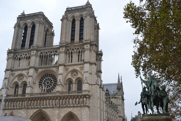 France, Paris, 20.11.2013: Notre-Dame de Paris, referred to simply as Notre-Dame, is a medieval Catholic cathedral on the Île de la Cité, in the 4th arrondissement of Paris, France.  - obrazy, fototapety, plakaty