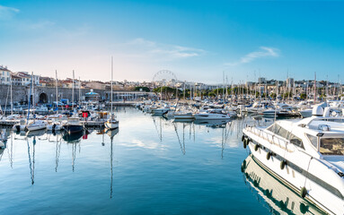 Yachts and sailboats moored in Antibes marina on a blue water - French Riviera, Cote D Azur, France - Summer vacation concept. - obrazy, fototapety, plakaty