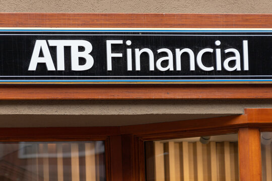 ATB Financial sign on busy Banff Avenue in Alberta, Canada. It is the only financial institution and Crown corporation wholly owned by the province of Alberta.
