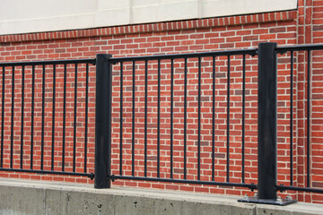 metal fence, representing confinement, division, and barriers in society, while also conveying...