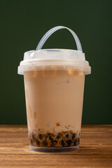 barrel of milktea with tapiocas at vertical composition
