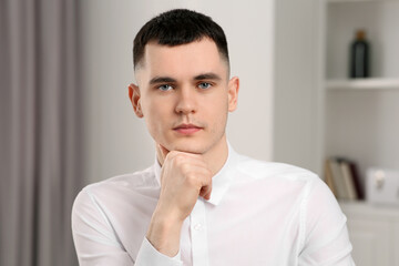 Young man having online video call at home, view from web camera