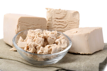 Pieces of compressed yeast isolated on white, closeup