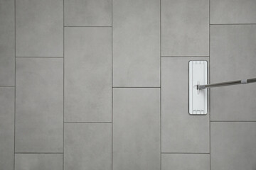 Cleaning grey tiled floor with mop, top view. Space for text