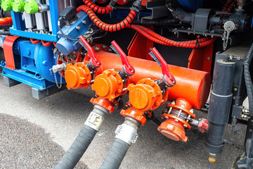 Equipment for pumping fuel. Thick hoses are connected to tank. Pumping gasoline for transportation....