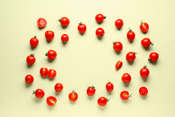 Naklejka na ściany i meble Frame made of fresh cherry tomatoes on light green background