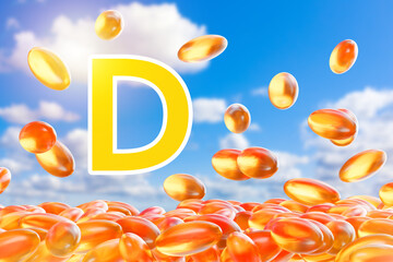 Vitamin d. Yellow capsules on blue sky background. Vitamin d for health support. Concept of using vitamins d2 and d1. Biologically active substances. Immunity care. Fish fat. 3d image