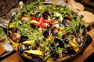 Spanish seafood paella in a pan.