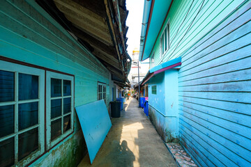 Narrow street in the floating fishing village of Koh Panyee made of houses on stilts in Phang Nga Bay, Andaman Sea, Thailand