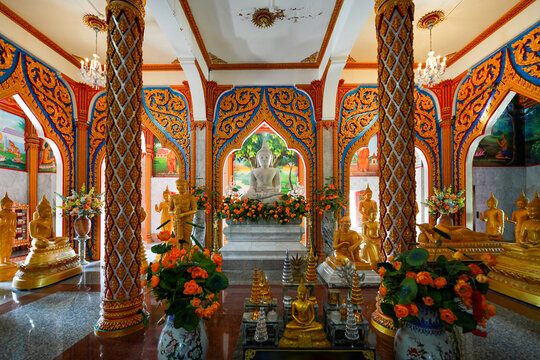 Buddha golden statues in the chedi (pagoda) of the Wat Chalong, a 19th century Buddhist temple on Phuket island in Thailand, Southeast Asia
