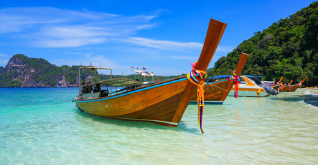 Longtails boats stranded in turquoise waters of Monkey Beach on Koh Phi Phi Don island in the Andaman Sea, Province of Krabi, Thailand © Alexandre ROSA