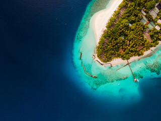 Aerial view of tropical island close up of beach and ocean, Baa Atoll, Maldives.