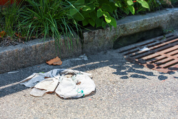 trash littered in the streets, symbolizing environmental degradation, negligence, and the urgent need for collective responsibility