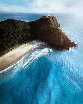 Aerial view of Cape Byron Lookout point with the lighthouse on the promontory, View of Tallow beach, Byron Bay, New South Wales, Australia.