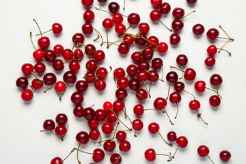 Many red sweet cherries on white background
