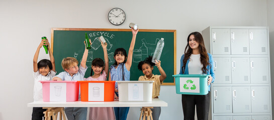 Group of student learn with teacher in classroom at elementary school. 