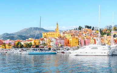 Menton, France - Panorama view of village with colorful houses on the French Riviera, Cote D Azur - View from the marina on the Mediterranean Sea.