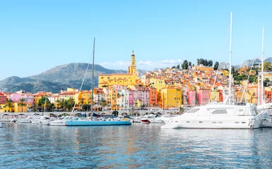 Wall murals Mediterranean Europe Menton, France - Panorama view of village with colorful houses on the French Riviera, Cote D Azur - View from the marina on the Mediterranean Sea.