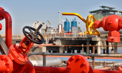 colourful valve pipes and control points on a refinery jetty-Victoria
