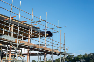 Residential house under construction with metal scaffolding around. Auckland.