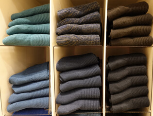 Colorful socks  on shelf in a shopping mall.    