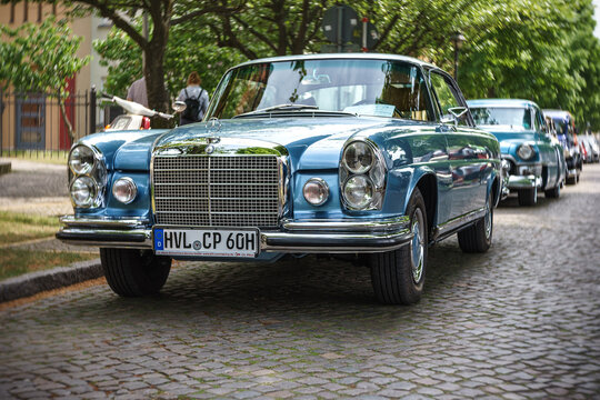 WERDER (HAVEL), GERMANY - MAY 20, 2023: The full-size luxury car Mercedes-Benz 280 SE Coupe (W111), 1960. Swirl bokeh, art lens. Oldtimer - Festival Werder Classics 2023