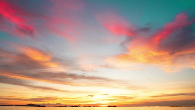 Sunset timelapse 4k Colorful sunset at the sea. Romantic Sunet go down, blue and orange clouds flow in sky. Majestic summer landscape. Beautiful sky fluffy clouds evening day