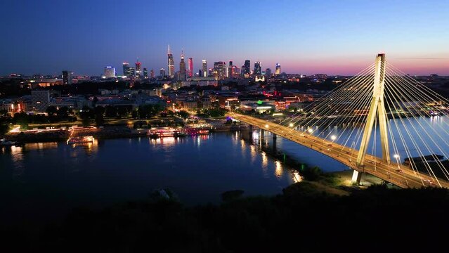 Aerial view of Warsaw Poland, at night. Warsaw business center at night: skyscrapers and Palace of Science and Culture. Drone footage of warsaw center at night. 