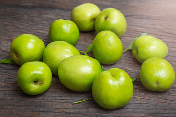Jojoba green on wooden surface