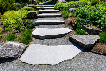 Large flagstone steps in a sunny summer garden
