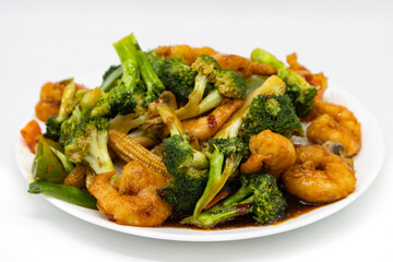 Chinese Style Szechuan Shrimp with Broccoli on a White Plate